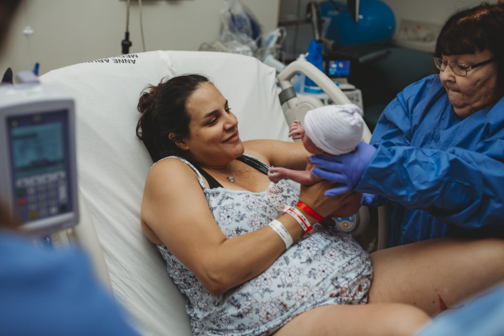 Mom holds baby for first time in Annapolis, MD at AAMC
