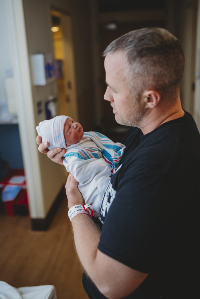 Dad holds new baby in Annapolis, MD at AAMC