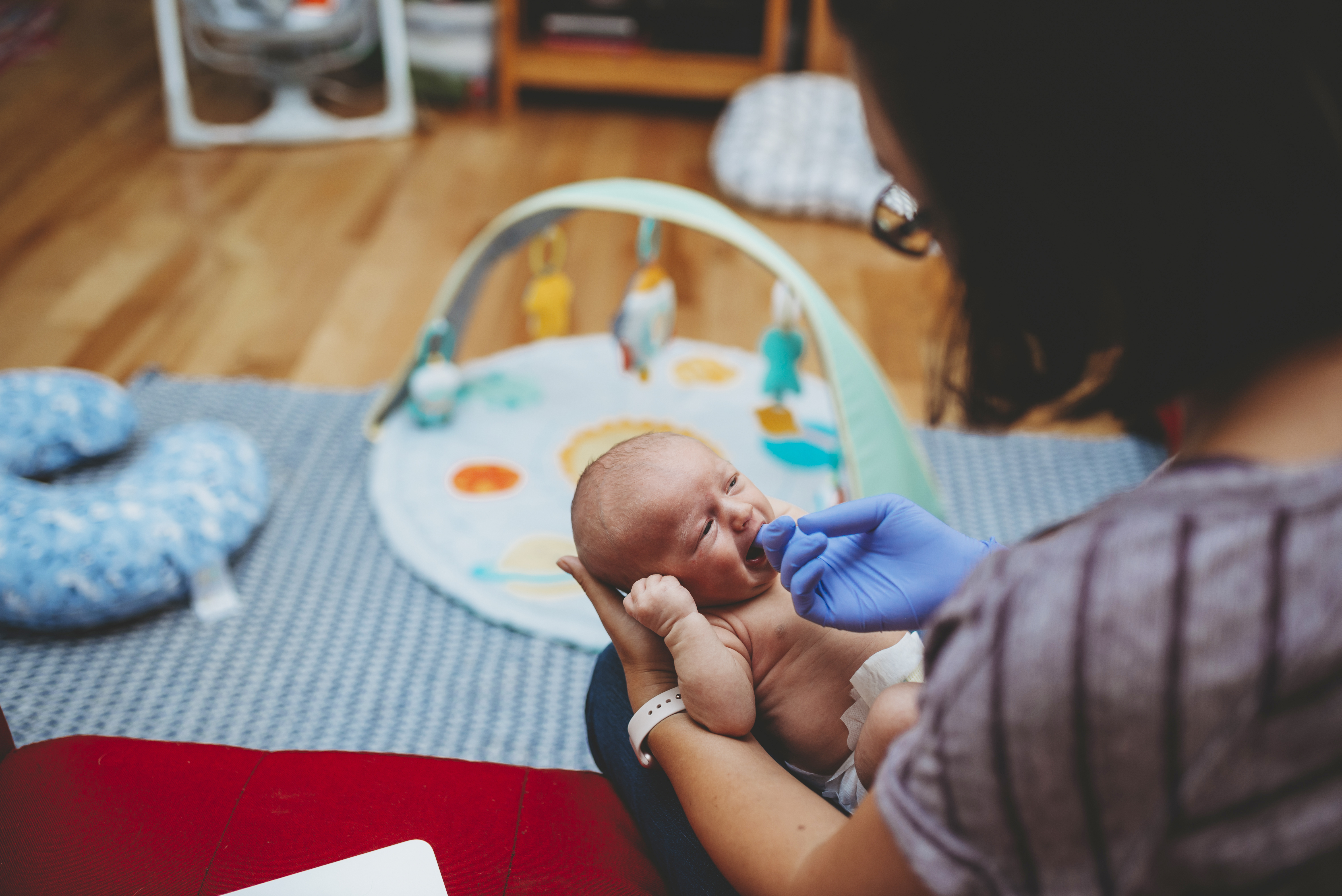 annapolis lactation consultant works with client to help nurse baby