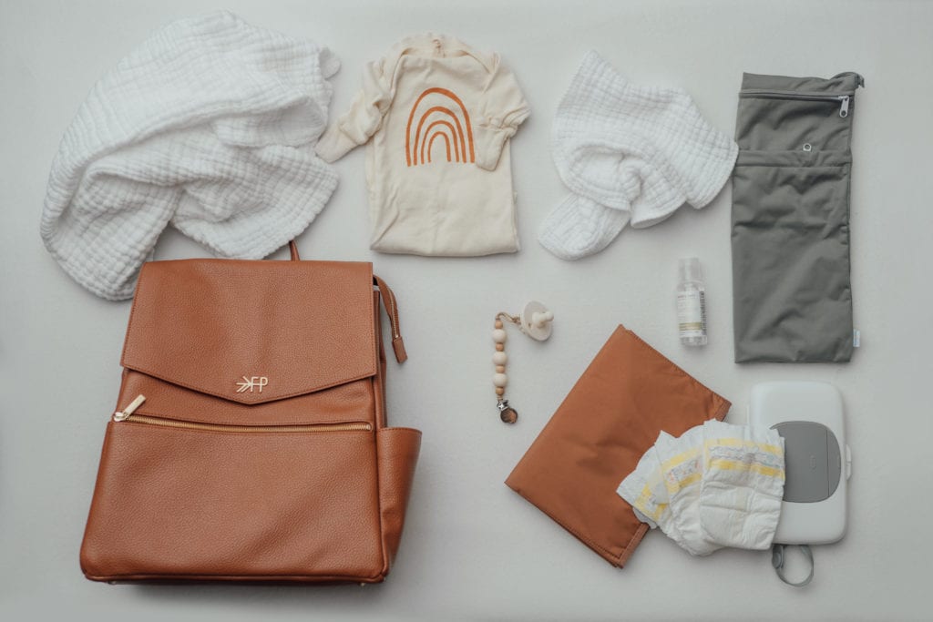 newborn diaper bag essentials by maryland newborn photographer