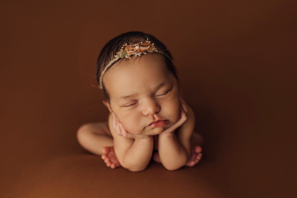 newborn baby in froggy pose during studio newborn session in Tampa