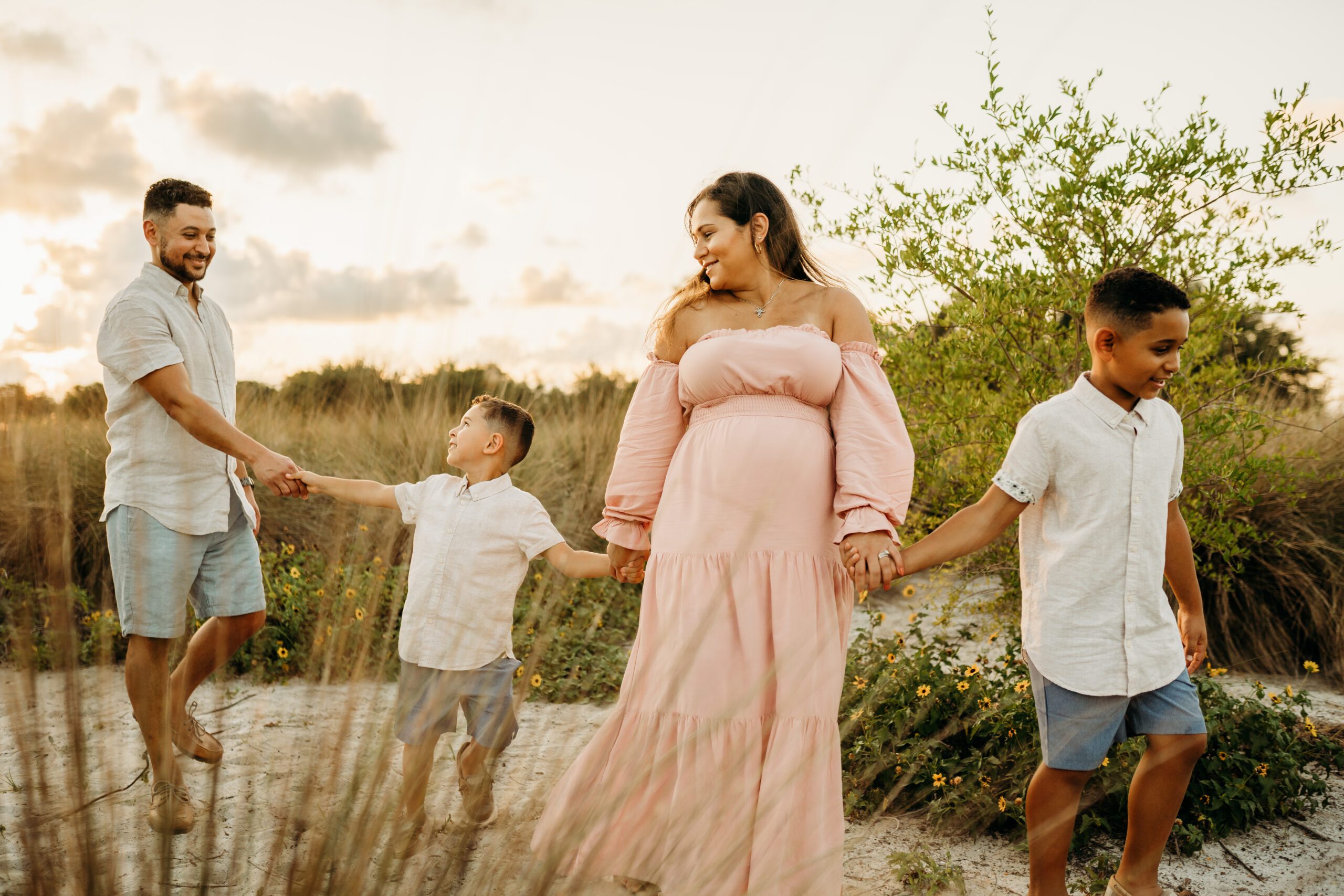 family a beach in clearwater for maternity session